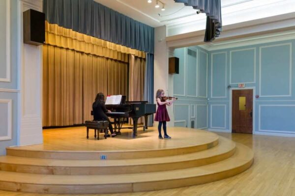 A young student performs at the Mary Louise Curtis Branch