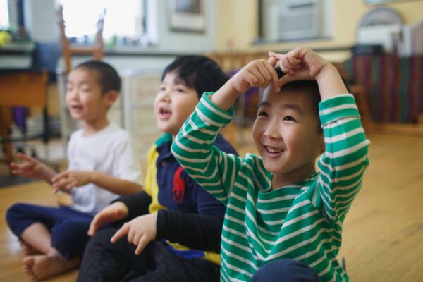 Students sing and move in a Children's Music Workshop class