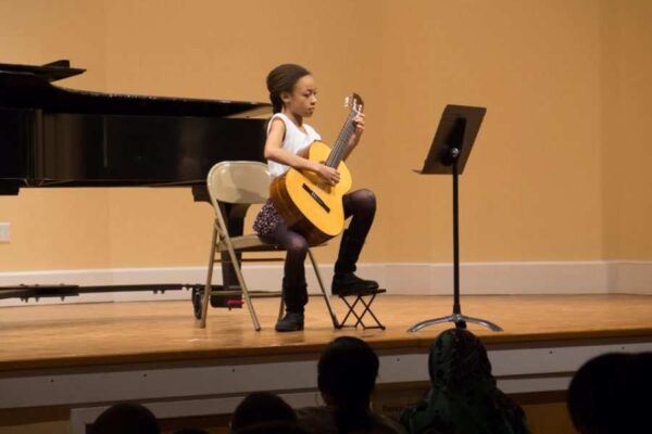A student performs at the Germantown Branch