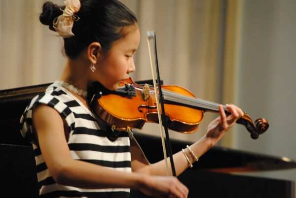 Violin performance at Settlement.
