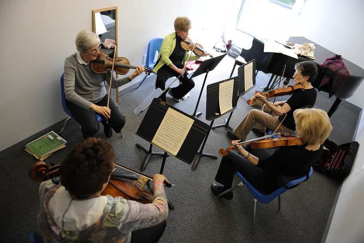 Adult Orchestra students rehearse at Settlement Music School.