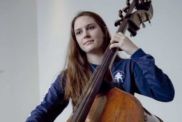 Settlement student playing double bass