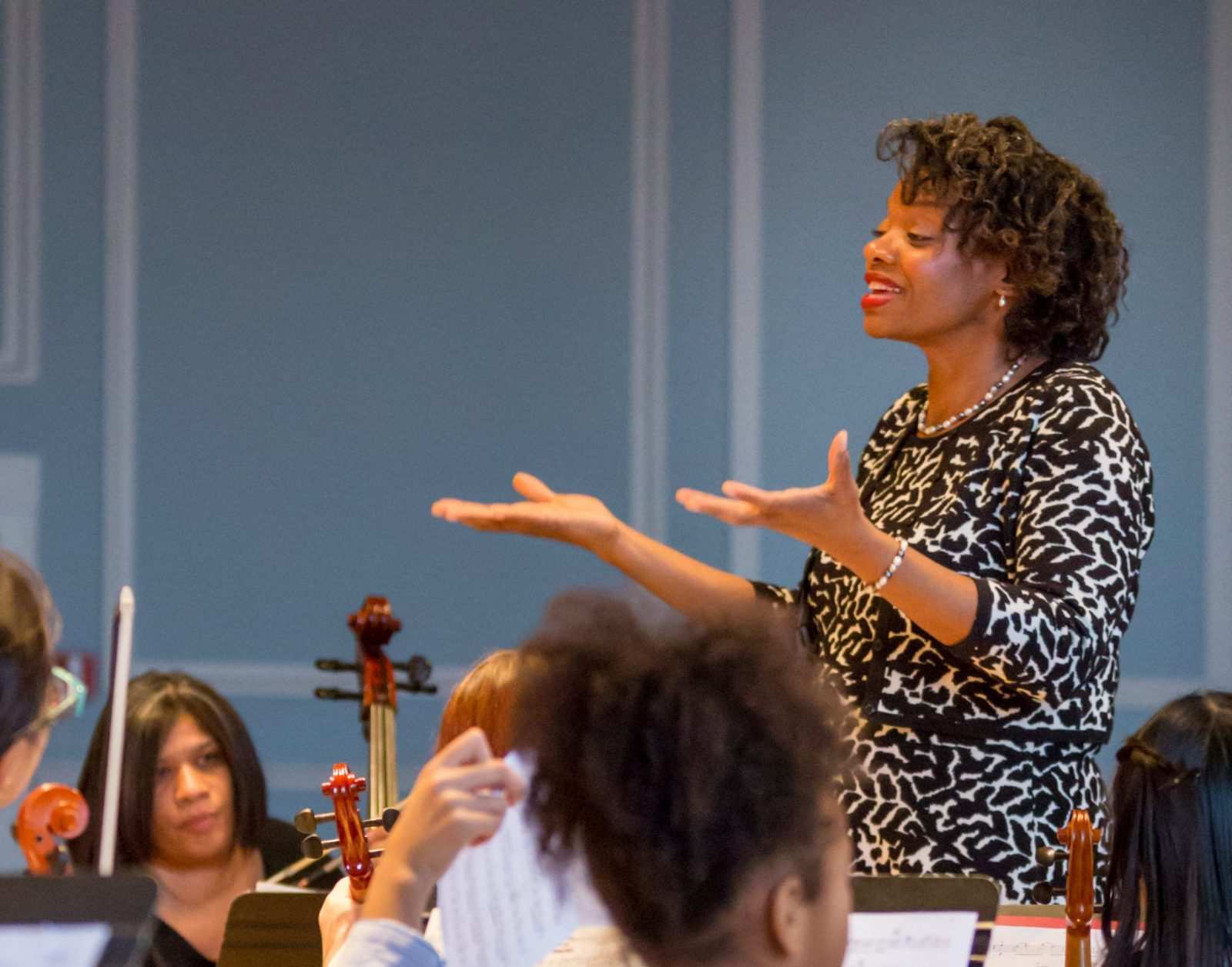 Monique Johnson conducts an orchestra performance at Mary Louise Curtis