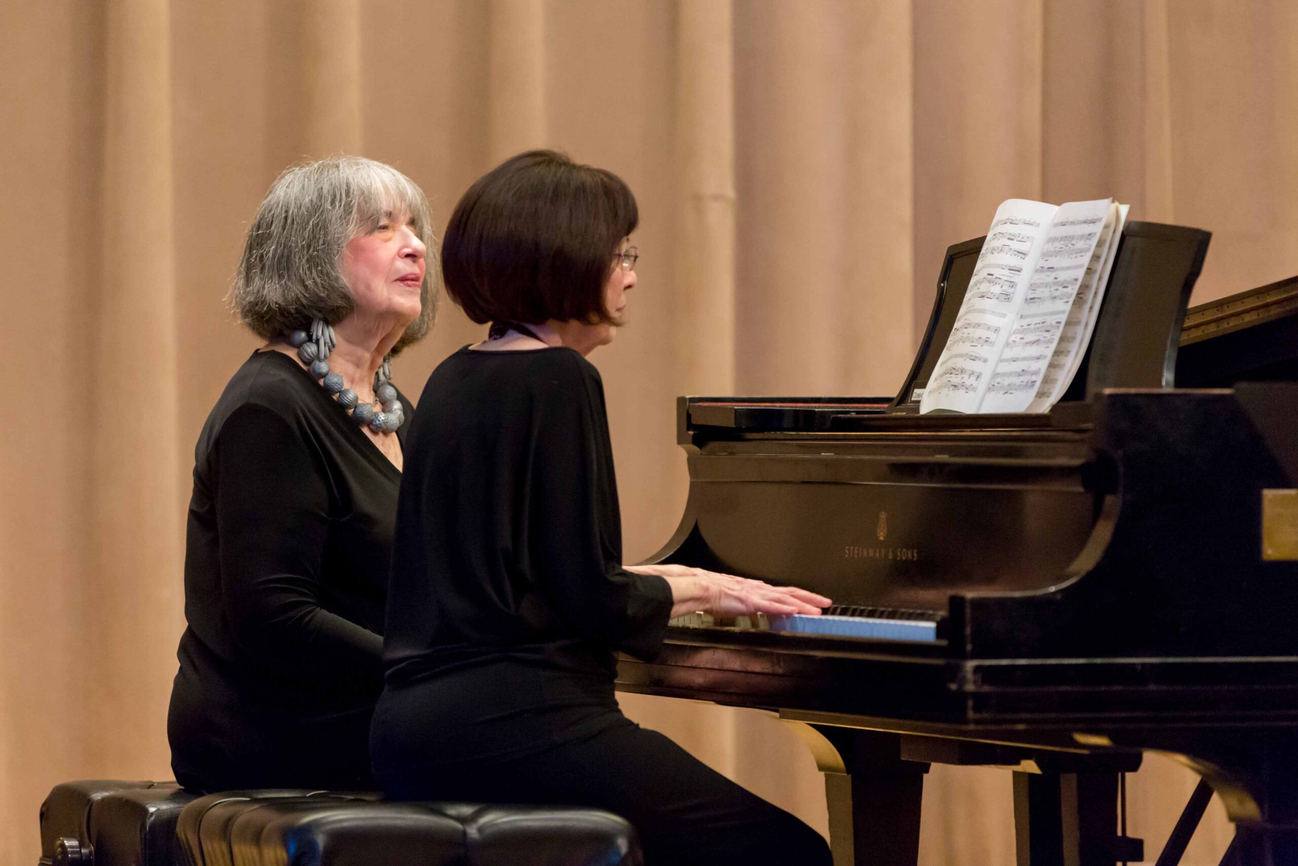 Leah Mellman and Libby Harwitz perform on stage