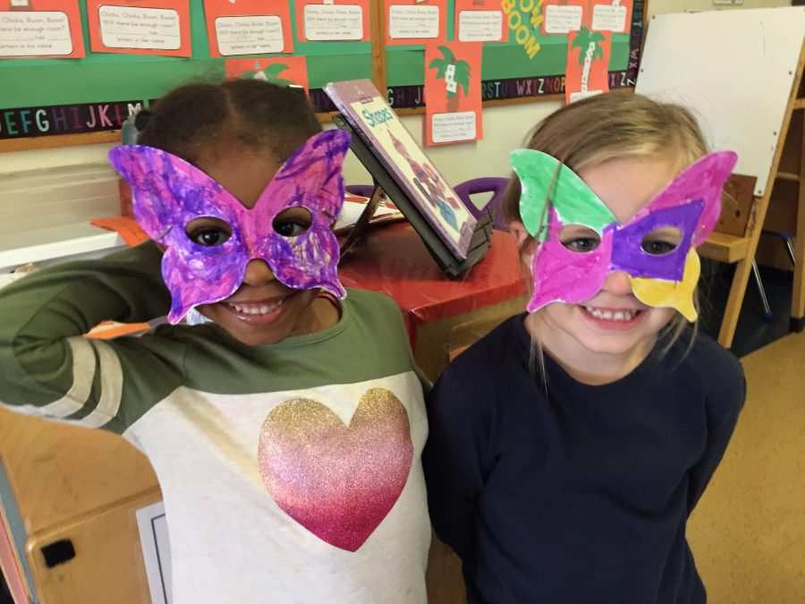 Kaleidoscope students show off their butterfly masks.