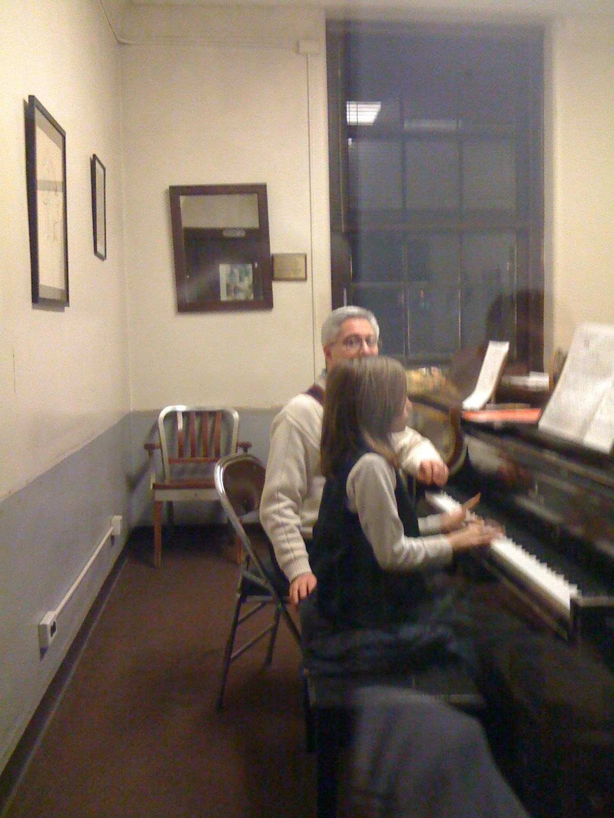 Young Viki learning piano with Michael Caruso.